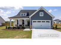 Two-story house with gray siding, white trim, and a two-car garage at 91 Priming Way, Angier, NC 27501