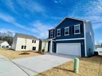 Charming two-story home with a 2 car garage and a well manicured lawn at 110 Gabriel Ct, Clayton, NC 27520