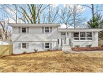 Newly renovated ranch home with white brick exterior and landscaped yard at 3408 Brentwood Rd, Raleigh, NC 27604