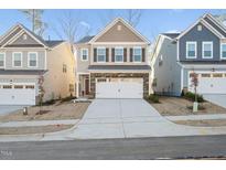 Two-story home with neutral siding and a two-car garage at 501 Hanover Shore Ln, Raleigh, NC 27610