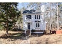 Two story house with white siding and a dark door at 117 London Plain Ct, Cary, NC 27513