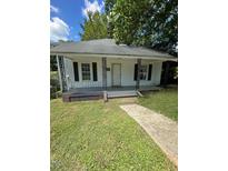 White house with porch and yard at 1512 Montrose St, Raleigh, NC 27603