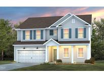 Two-story house with light beige vinyl siding, dark brown roof, and a two-car garage at 1111 Freestone Rd, Durham, NC 27703