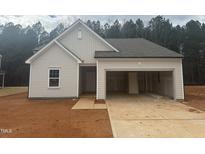 Newly constructed house with a two-car garage and neutral color scheme at 6842 Galloway Dr, Middlesex, NC 27557