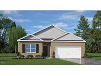 Brick house with a large white garage door and landscaping at 3605 Sorda Ct, Raleigh, NC 27610