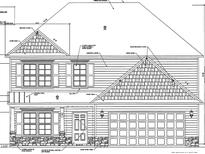 Two-story house plan with stone accents, two-car garage, and shake siding at 95 Malbec Way, Youngsville, NC 27596
