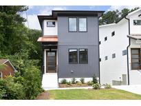 Modern two-story home with gray and white exterior, and a landscaped front yard at 508 Lakeland St # B, Durham, NC 27701
