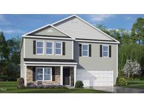 Two-story house with gray siding, stone accents, and a two-car garage at 111 Reagan Crest Dr, Clayton, NC 27520