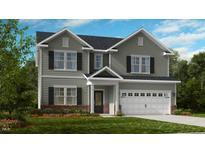 Two-story house with gray siding, brick accents, and a two-car garage at 664 Morning Glade St, Wake Forest, NC 27587