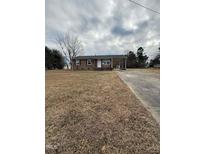 Brick ranch home with carport and spacious yard at 2223 Willie Pace Rd, Burlington, NC 27217