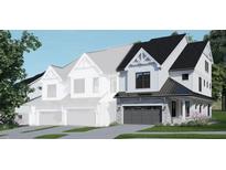 Modern farmhouse style home with gray stone accents and a two-car garage at 4081 Elk Creek Ln # 07, Raleigh, NC 27612
