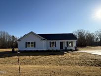 Newly constructed home with gray roof and white siding at 52 Faucette Dr, Selma, NC 27576