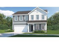 Two-story home with gray siding, white accents, and a two-car garage at 78 Queenstown Drive # 37 Brunswick, Kenly, NC 27542