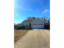 Charming single-story home featuring a two-car garage, well-maintained lawn, and a classic design, perfect for comfortable living at 216 Parrish Farm Lane Ln, Benson, NC 27504