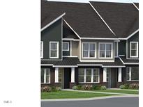 Charming townhome exteriors featuring manicured lawns and inviting entryways at 3019 White Rail Dr, Fuquay Varina, NC 27526