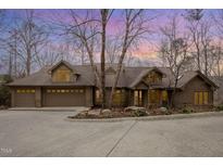 Two-story home with a large driveway and attached three-car garage at 39415 Glenn Glade, Chapel Hill, NC 27517