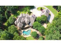 Luxury home with pool and large lot surrounded by trees at 15508 Possum Track Rd, Raleigh, NC 27614