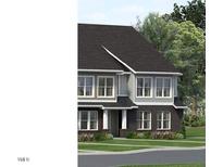 Charming two-story home features large windows, manicured landscaping, and inviting curb appeal at 3025 White Rail Dr, Fuquay Varina, NC 27526