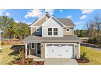 Charming two-story home with a two-car garage and beautiful architectural details at 36 Railcar Way, Clayton, NC 27520