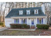 Charming two-story house with a front porch and landscaped yard at 1003 Pagoda Pl, Knightdale, NC 27545