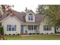 Charming two-story house with a landscaped lawn and attractive curb appeal at 270 W Silverado Ct, Kenly, NC 27542