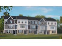 Two-story townhome with gray siding, white trim, and a grassy lawn at 2259 Horton Park Dr, Apex, NC 27539