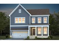 Two-story home with gray siding, white trim, and a two-car garage at 231 Circle City Way, Pittsboro, NC 27312