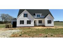 Charming new build features white siding, black shutters and a welcoming front porch at 5377 River Buck Rd, Spring Hope, NC 27882