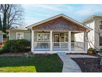 Charming craftsman home with a covered front porch and well-manicured lawn at 717 Dorothea Dr, Raleigh, NC 27603