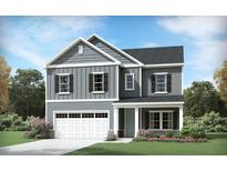 Two-story house with gray siding, stone accents, and a two-car garage at 908 Thimbleweed Way, Wake Forest, NC 27587