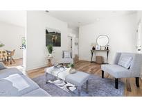 Bright living room with modern furnishings, hardwood floors, and stylish décor at 1035 W Murray Ave, Durham, NC 27704