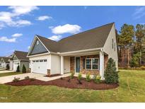 Newly constructed home with stone accents and a 2-car garage at 201 Brickwell Way, Youngsville, NC 27596
