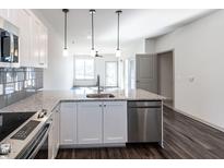 Modern kitchen features stainless steel appliances and granite countertops at 2325 Gathering Square Ct Ct # 2325, Fuquay Varina, NC 27526