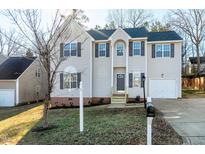 Charming two-story home with neutral siding, blue roof, and well-manicured front lawn at 2901 Alder Ridge Ln, Raleigh, NC 27603