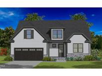 Two-story home with gray roof, white siding, and a two-car garage at 320 Pilot Ridge Rd, Zebulon, NC 27597