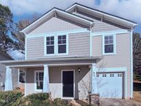 Two-story house featuring a neutral color scheme and a two-car garage at 83 Valleyfield Dr, Clayton, NC 27527