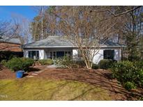 Ranch style home with a gray exterior, blue door, and landscaping at 2716 Townedge Ct, Raleigh, NC 27612