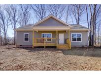 Newly constructed home with gray siding and a covered porch at 512-A E Graham St, Mebane, NC 27302
