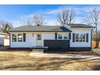 Charming ranch home features a renovated exterior, fresh landscaping, and a welcoming front porch at 803 Oakley St, Graham, NC 27253
