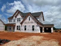 Under construction two-story home with a spacious layout and attached two-car garage at 88 Tennyson Dr, Garner, NC 27529