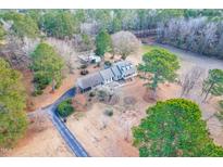 Aerial view of house, detached garage, and expansive yard at 1741 W Blackman Rd, Dunn, NC 28334