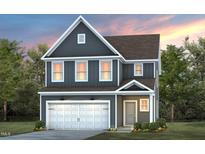Two-story home with gray siding, white trim, and a two-car garage at 2904 Huxley Way, Apex, NC 27502