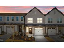 Modern two-story townhome with attached garage and landscaped yard at 608 Marshskip Way, Rolesville, NC 27587