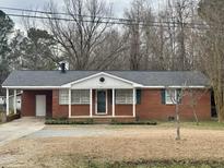 Brick ranch house with attached garage and carport at 3395 Nc Hwy 210, Smithfield, NC 27577