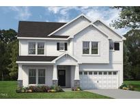 Two-story home with white siding, gray roof, and a two-car garage at 147 Charlotte Knoll St # 14, Zebulon, NC 27597
