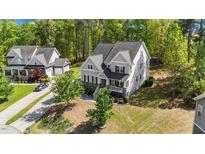 Charming two-story home with manicured lawn and inviting front porch at 3308 Eden Grove Rd, Fuquay Varina, NC 27526