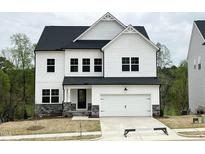 Beautiful two-story home with white siding, black roof, and stone accents at 4408 Emeline Way # 34, Fuquay Varina, NC 27526