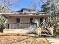 Charming single story home with front porch and steps at 1107 Franklin St, Durham, NC 27701