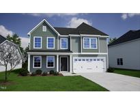 Two-story house with gray siding, white trim, and a two-car garage at 139 Grove Township Way, Angier, NC 27501