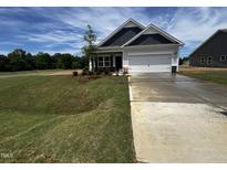 Charming single-Gathering home with a manicured lawn and a freshly power-washed driveway at 19 E American Marigold Dr # 34, Benson, NC 27504